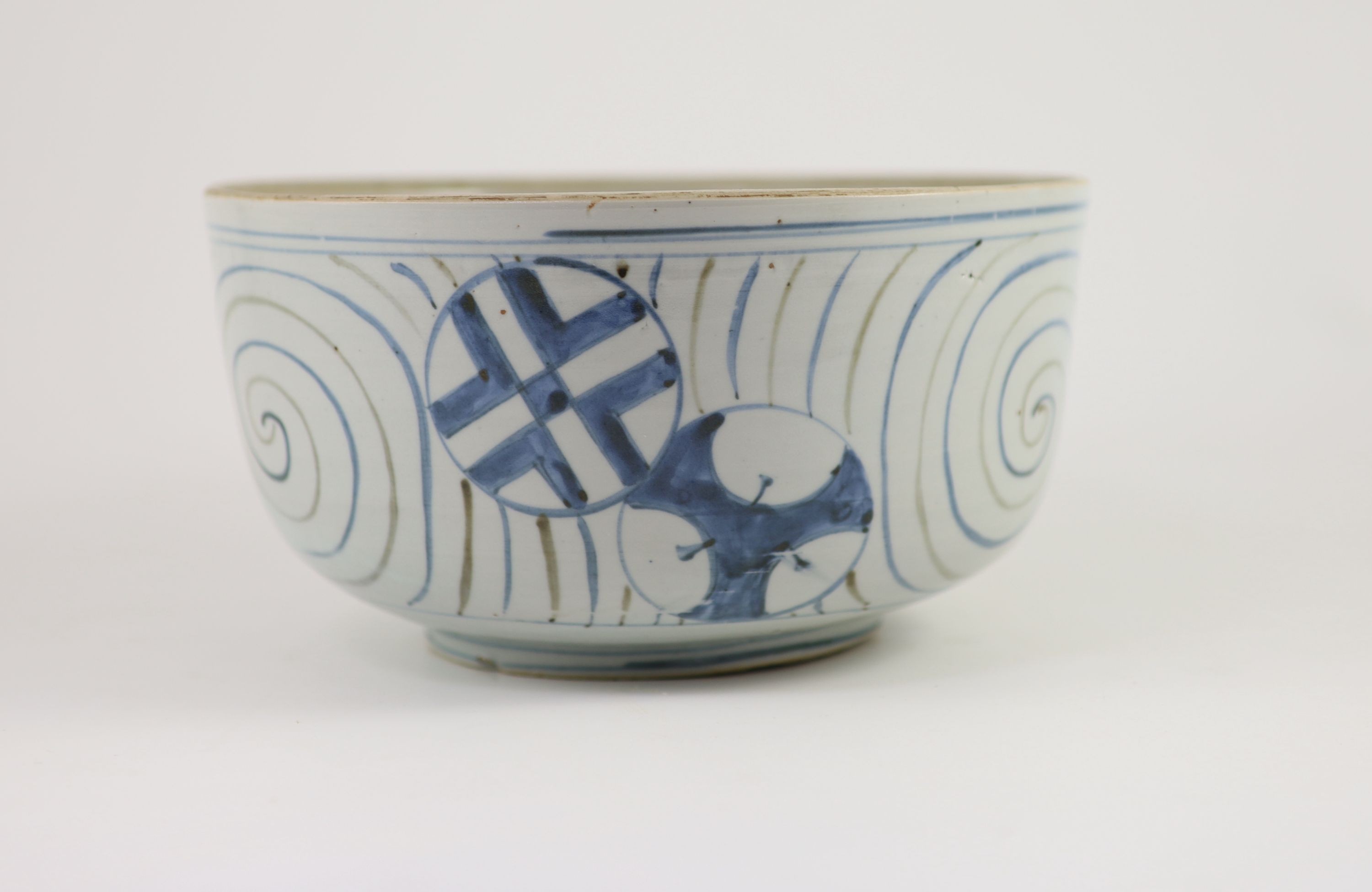 An unusual underglaze blue and iron brown bowl, probably Korean, Joseon dynasty, 18th/19th century, 23cm diameter, lacking its cover, cracked